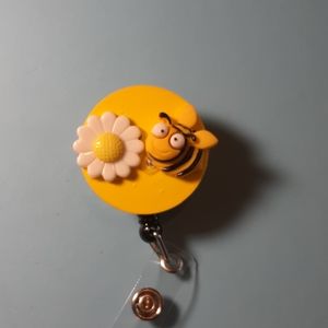 Retractable name badge holder